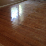 Polished wooden floor reflecting natural light.