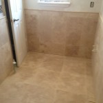 Travertine floor and wall, with wainscot