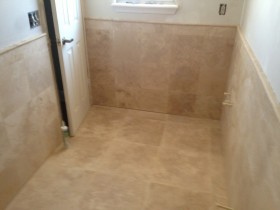 Travertine floor and wall, with wainscot