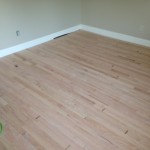 Light sanding prepares hardwood floors for stain and finish
