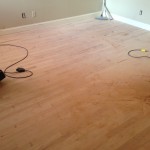 Light sanding prepares hardwood floors for stain and finish