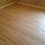 Light sanding prepares hardwood floors for stain and finish