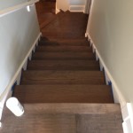 Solid Oak stair treads refinished to match Maple wood flooring color