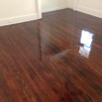 Refinished old hardwood floors shine as finish dries