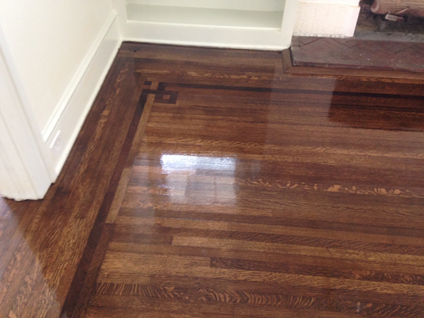 refinished old hardwood floors shine as finish dries