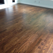 Dark wooden floor in empty room.
