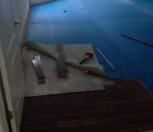 Taking up the blue carpet padding, as we begin to install wire brushed, engineered White Oak flooring