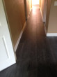 Blackish-gray, wire brushed White Oak flooring in the hallway