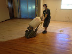 Sanding wood flooring at a 45 degree angle to remove cupping