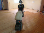 Sanding wood flooring at a 45 degree angle to remove cupping