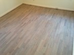 Stained and refinished Red Oak floor for the beach house look