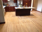 Alternate view of new Kitchen Cabinets and Island by Horn Builders, on solid Red Oak flooring repaired by Dan's Floor Store