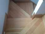 Detail view of pie-shaped landings in solid American Cherry staircase