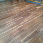 Wide engineered, weathered Walnut flooring with white details for the beachy look