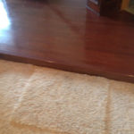 Existing carpeting lower level and existing wood flooring upper level