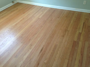 Old solid Red Oak wood floor after repair & refinishing