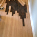 Weaving in new Red Oak wood floor planks.