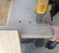 Boring holes in white oak planks for walnut plugs
