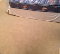 Old carpeting on the bedroom floor, to be removed by Dan's Floor Store of Ponte Vedra - 904.887.8303