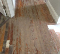 Solid Heart Pine wood floors in a home in historic Springfield prior to refinishing