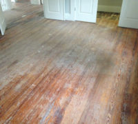 Solid Heart Pine wood floors in a home in historic Springfield before refinishing