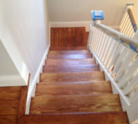 Old wood stairs in a historic Springfield home after refinishing