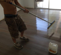 Applying Bona Mega Clear HD finish to sanded White Oak wood flooring