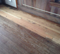 One pass with sander reveals character of solid Heart Pine wood floor