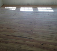 Sanded solid Heart Pine wood floor during refinishing