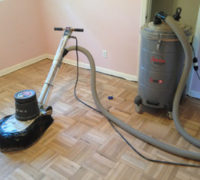 Sanding the DIY refinished parquet wood floor