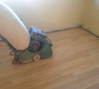 Vacuum sanding solid Red Oak wood flooring