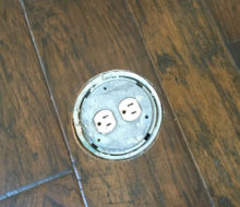 New hickory wood flooring with in-floor electrical outlet