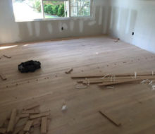Red Oak wood flooring with nickels installed to make expansion joints