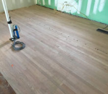 Red Oak wood flooring with nickels installed to make expansion joints