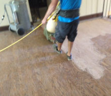 Sanding the wood floor landing