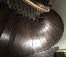 View of refinished stairs and edge of landing from landing