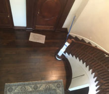 View of variable width solid Hickory wood flooring and refinished stairs from refinished landing.