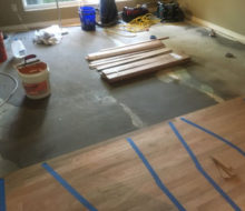 Installing rotary sawn Red Oak flooring on leveled concrete slab