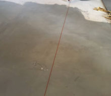 Snapping a chalk line on leveled subfloor while installing French Oak wood floor