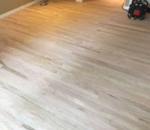 Unfinished, rotary sawn Red Oak wood flooring installed