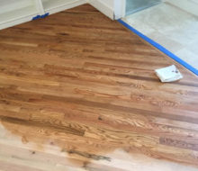 Applying golden oak stain to red oak wood flooring
