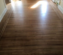 Face nailed white oak flooring with walnut strip border after refinishing