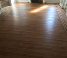 Face nailed white oak flooring with walnut strip border after refinishing