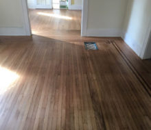 Face nailed white oak flooring with walnut strip border after refinishing