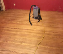 Face nailed white oak flooring with walnut strip border and vacuum after sanding and hand scraping