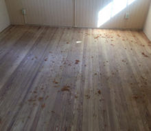 Old heart pine wood flooring after sanding and hand scraping