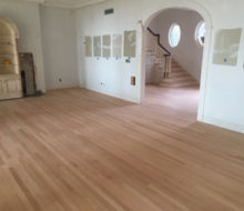 After sanding red oak wood floor and stair treads