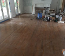 Dan's Floor Store gear on old red oak wood floor