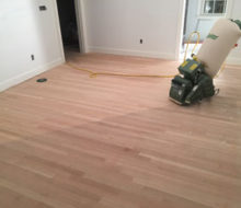 Lagler-Hummel belt sander on sanded red oak wood floor