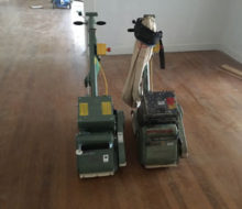 new and old Lagler-Hummel belt sanding machines, side by side